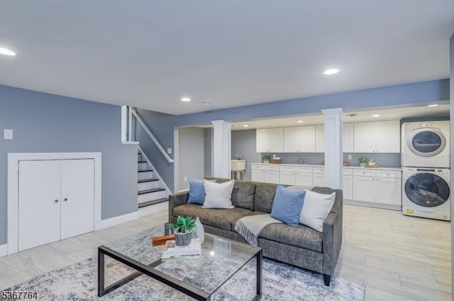 106 Woodbine Cir, New Providence Boro, NJ 07974 - living room featuring estacked washer and dryer, stairs, decorative columns, and recessed lighting
