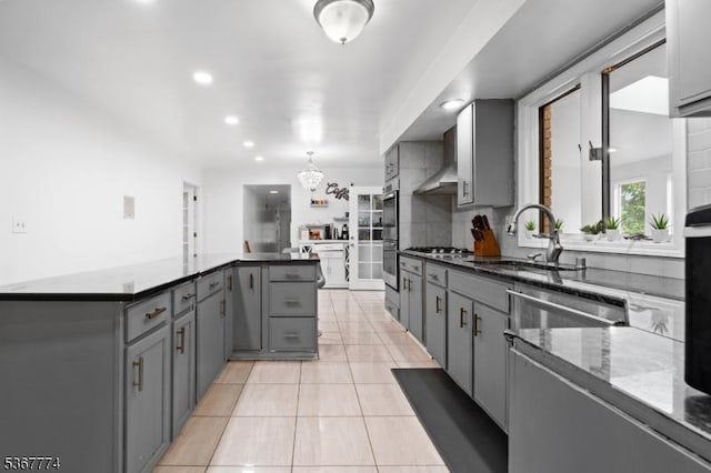 5 Peppermint Hill Rd, North Brunswick Twp, NJ 08902 - kitchen with gray cabinets, a kitchen island, light tile patterned flooring, stainless steel appliances, and recessed lighting