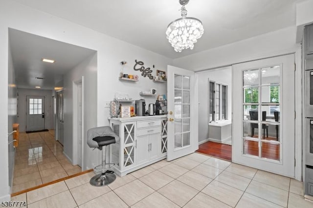 5 Peppermint Hill Rd, North Brunswick Twp, NJ 08902 - bar featuring light tile patterned flooring, a chandelier, and oven