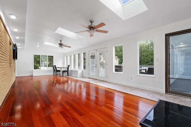 5 Peppermint Hill Rd, North Brunswick Twp, NJ 08902 - unfurnished living room featuring a skylight, ceiling fan, wood finished floors, and recessed lighting