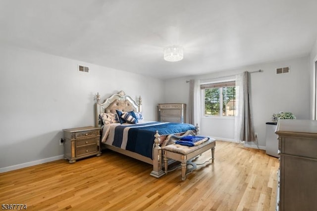5 Peppermint Hill Rd, North Brunswick Twp, NJ 08902 - bedroom with light wood-style flooring and a chandelier