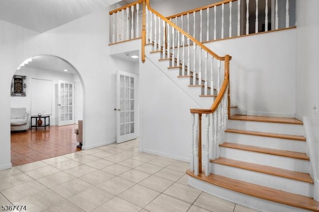 5 Peppermint Hill Rd, North Brunswick Twp, NJ 08902 - stairs with arched walkways, tile patterned flooring, and a high ceiling