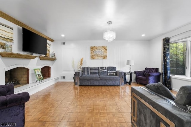 5 Peppermint Hill Rd, North Brunswick Twp, NJ 08902 - living room featuring a fireplace with raised hearth, a chandelier, and recessed lighting