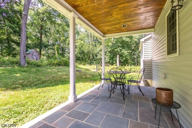 30 Bissell Rd, Tewksbury Twp, NJ 08833 - view of patio featuring outdoor dining area and a storage unit
