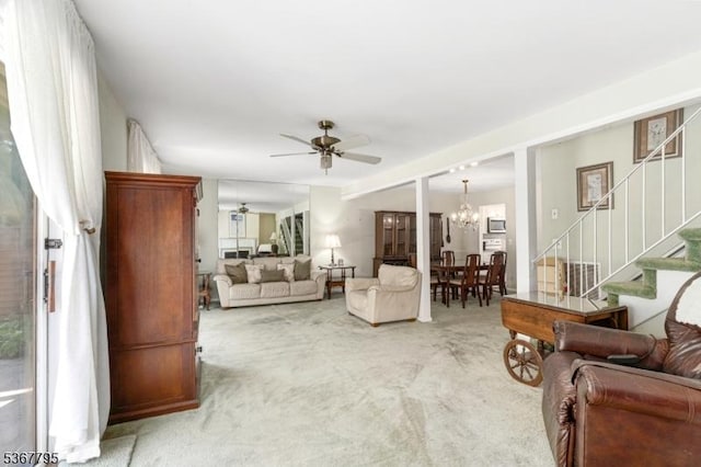 42 Carriage Ln, Sparta Twp, NJ 07871 - living area featuring stairway, ceiling fan, carpet flooring, and a chandelier