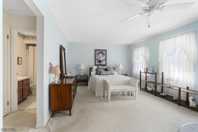 42 Carriage Ln, Sparta Twp, NJ 07871 - bedroom with light carpet, connected bathroom, and ceiling fan