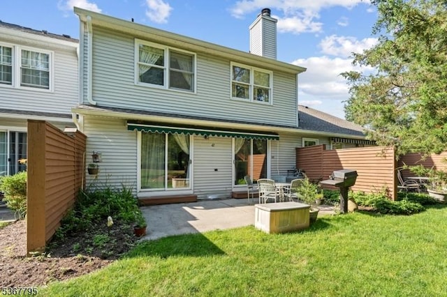 42 Carriage Ln, Sparta Twp, NJ 07871 - back of property with a chimney and a patio area
