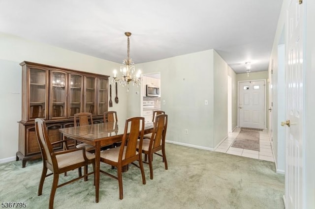 42 Carriage Ln, Sparta Twp, NJ 07871 - dining room with a chandelier, light carpet, and light tile patterned floors