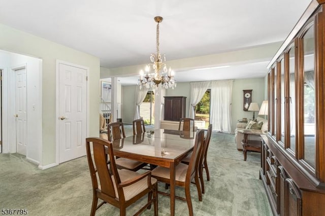 42 Carriage Ln, Sparta Twp, NJ 07871 - dining area with light colored carpet and a chandelier