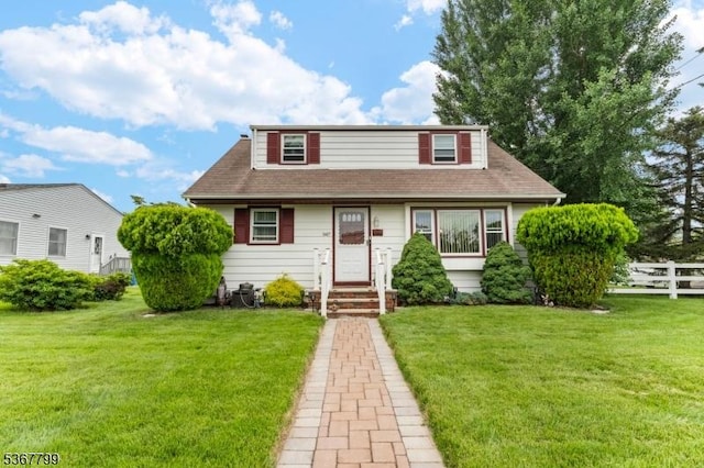 947 Boesel Ave, Manville Boro, NJ 08835 - view of front facade featuring a shingled roof