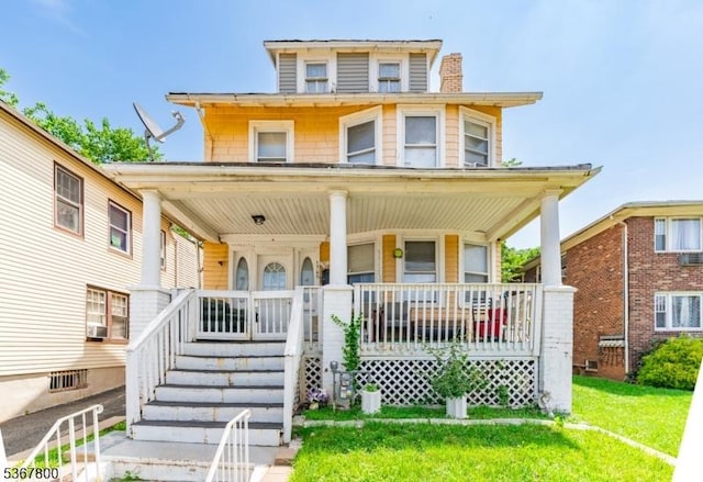1705 Essex St, Rahway City, NJ 07065 - view of front facade with covered porch, a chimney, and cooling unit