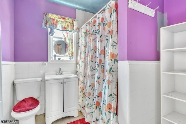 1705 Essex St, Rahway City, NJ 07065 - full bath featuring a wainscoted wall, vanity, a shower with shower curtain, tile walls, and tile patterned flooring
