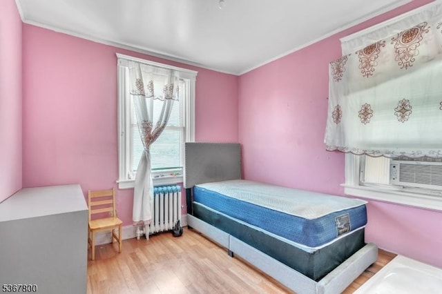 1705 Essex St, Rahway City, NJ 07065 - bedroom with radiator heating unit, wood finished floors, and ornamental molding