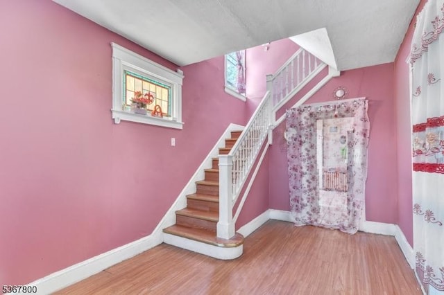 1705 Essex St, Rahway City, NJ 07065 - staircase with baseboards and wood finished floors