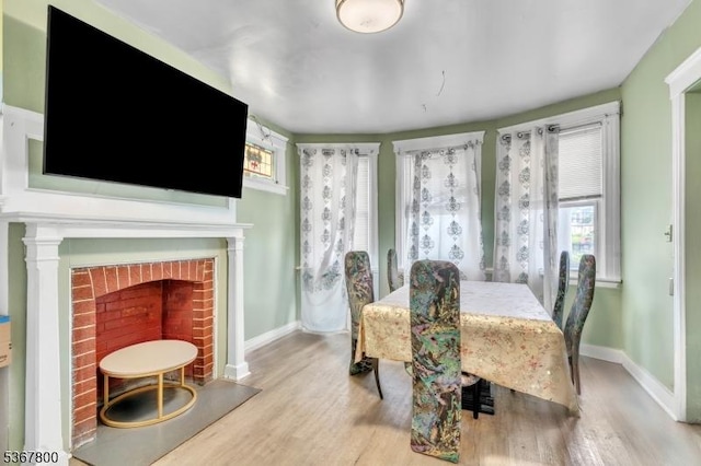 1705 Essex St, Rahway City, NJ 07065 - dining space with wood finished floors and a brick fireplace