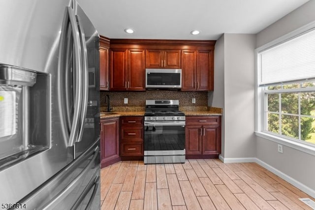 16 Edith Dr, Franklin Twp, NJ 08873 - kitchen with stainless steel appliances, backsplash, light wood-type flooring, light stone countertops, and recessed lighting