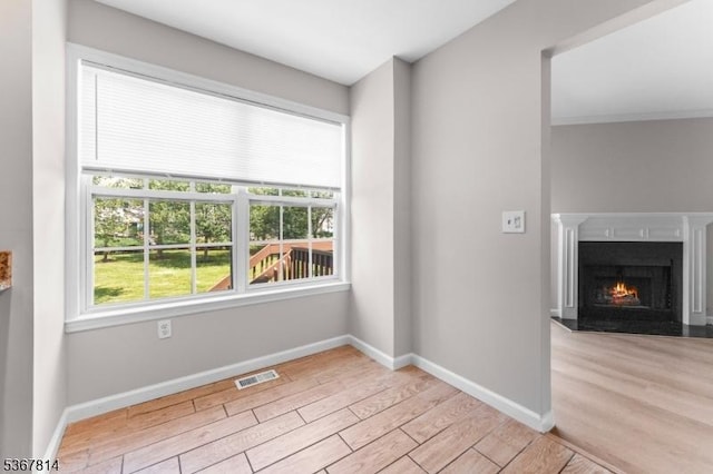 16 Edith Dr, Franklin Twp, NJ 08873 - unfurnished dining area featuring wood finished floors and a fireplace with flush hearth