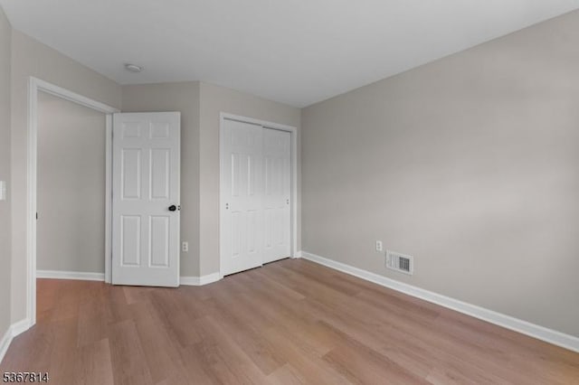 16 Edith Dr, Franklin Twp, NJ 08873 - unfurnished bedroom with light wood finished floors and a closet