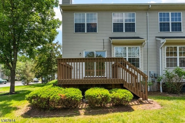 16 Edith Dr, Franklin Twp, NJ 08873 - rear view of property featuring a wooden deck, a chimney, and a lawn
