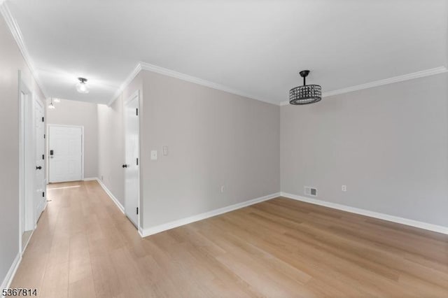 16 Edith Dr, Franklin Twp, NJ 08873 - spare room featuring ornamental molding and light wood-style flooring