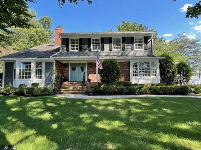 4 Edith Ct, East Hanover Twp, NJ 07936 - traditional-style home featuring a chimney and a front lawn