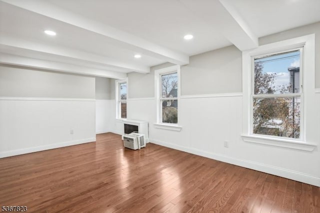 621 Roosevelt Ave, Carteret Boro, NJ 07008 - unfurnished living room featuring wood finished floors, plenty of natural light, beamed ceiling, and recessed lighting