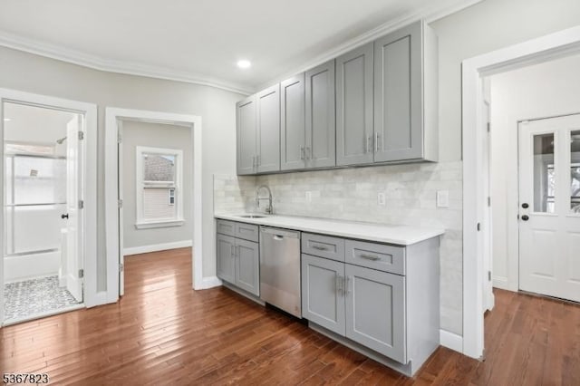 621 Roosevelt Ave, Carteret Boro, NJ 07008 - kitchen featuring dishwasher, gray cabinets, dark wood-style floors, decorative backsplash, and ornamental molding