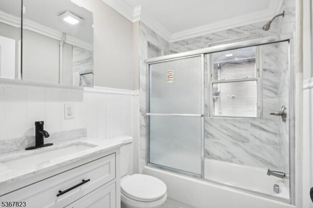 621 Roosevelt Ave, Carteret Boro, NJ 07008 - bathroom featuring vanity, enclosed tub / shower combo, crown molding, wainscoting, and a decorative wall