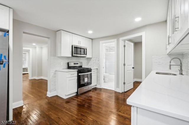 621 Roosevelt Ave, Carteret Boro, NJ 07008 - kitchen with stainless steel appliances, decorative backsplash, white cabinets, light countertops, and recessed lighting