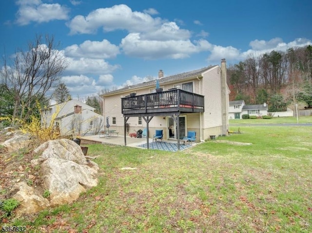 10 Hemlock Dr, Franklin Boro, NJ 07416 - back of property featuring a wooden deck, a patio, a yard, and a chimney