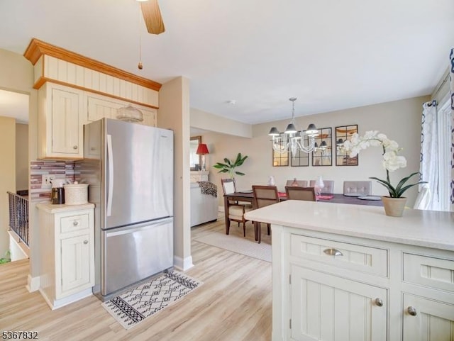 10 Hemlock Dr, Franklin Boro, NJ 07416 - kitchen with freestanding refrigerator, light wood-style floors, a chandelier, and light countertops