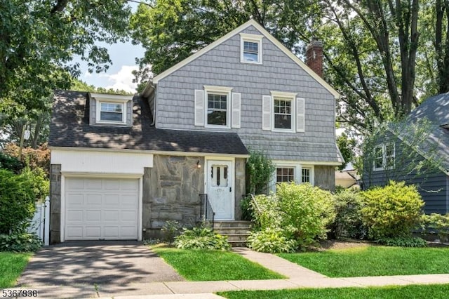 173 Raab Ave, Bloomfield Twp, NJ 07003 - view of front facade with asphalt driveway and a chimney