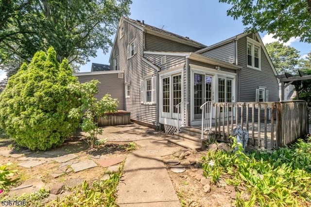 173 Raab Ave, Bloomfield Twp, NJ 07003 - rear view of house featuring a covered hot tub, a deck, and a patio