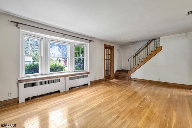 173 Raab Ave, Bloomfield Twp, NJ 07003 - unfurnished living room with radiator heating unit, hardwood / wood-style floors, and stairway