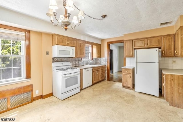 173 Raab Ave, Bloomfield Twp, NJ 07003 - kitchen with white appliances, a chandelier, light countertops, backsplash, and a textured ceiling