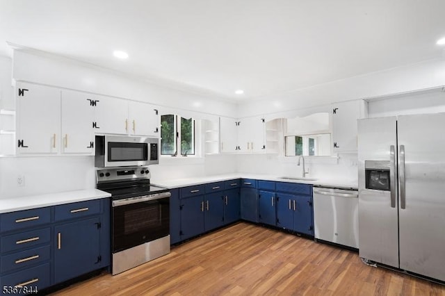 19 Pleasant View Ave, Washington Twp, NJ 07882 - kitchen featuring stainless steel appliances, blue cabinetry, open shelves, light countertops, and recessed lighting