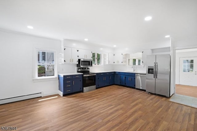 19 Pleasant View Ave, Washington Twp, NJ 07882 - kitchen with appliances with stainless steel finishes, blue cabinetry, wood finished floors, plenty of natural light, and recessed lighting