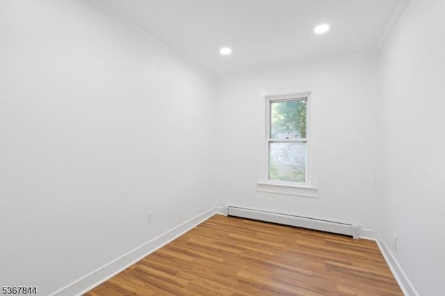 19 Pleasant View Ave, Washington Twp, NJ 07882 - spare room featuring a baseboard heating unit, light wood-style flooring, recessed lighting, and crown molding