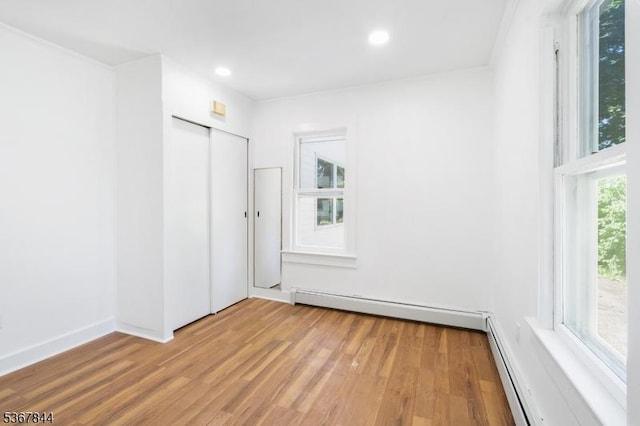 19 Pleasant View Ave, Washington Twp, NJ 07882 - unfurnished bedroom with wood finished floors, recessed lighting, baseboard heating, and a closet
