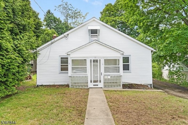 19 Pleasant View Ave, Washington Twp, NJ 07882 - bungalow-style house featuring a front lawn, a sunroom, and a chimney