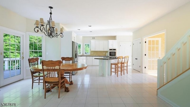 64 Sneider Rd, Warren Twp, NJ 07059 - dining space with stairs, a chandelier, and light tile patterned flooring
