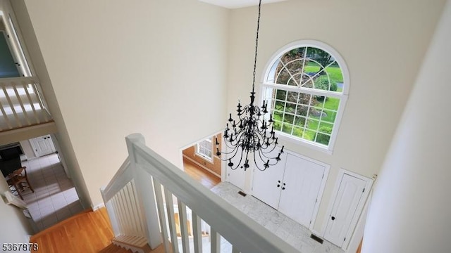 64 Sneider Rd, Warren Twp, NJ 07059 - foyer entrance featuring a towering ceiling, a chandelier, and wood finished floors