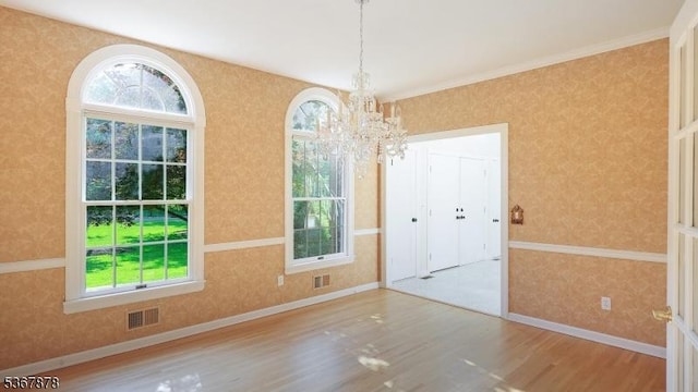 64 Sneider Rd, Warren Twp, NJ 07059 - unfurnished dining area featuring wallpapered walls, wood finished floors, and a chandelier