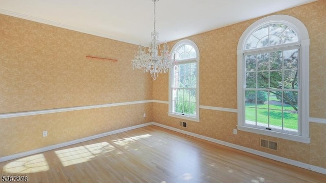 64 Sneider Rd, Warren Twp, NJ 07059 - spare room featuring wallpapered walls, a chandelier, and wood finished floors