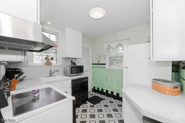 408 Sanford Ave, Hillside Twp, NJ 07205 - kitchen with stainless steel microwave, ventilation hood, healthy amount of natural light, tile walls, and white cabinetry