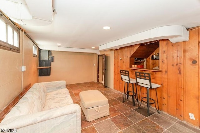 408 Sanford Ave, Hillside Twp, NJ 07205 - living room with wooden walls, a dry bar, stone finish flooring, and recessed lighting