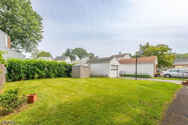 408 Sanford Ave, Hillside Twp, NJ 07205 - view of yard featuring a storage shed, a garage, and driveway