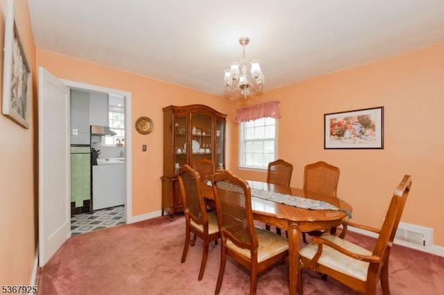 408 Sanford Ave, Hillside Twp, NJ 07205 - dining space with washer / dryer, light carpet, and a chandelier