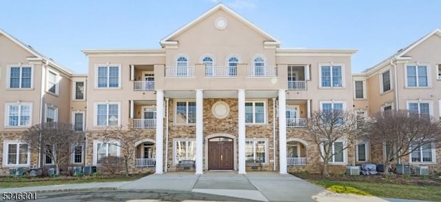 1208 Clinton Ln Unit 1208, Rockaway Twp, NJ 07866 - view of front of home with stucco siding and stone siding
