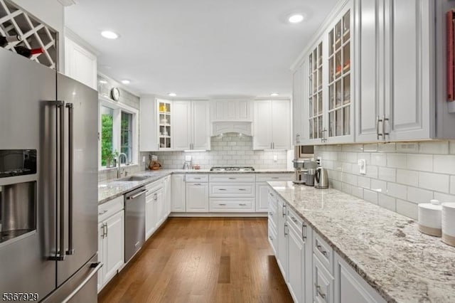 11 Old Farm Rd, North Caldwell Boro, NJ 07006 - kitchen featuring stainless steel appliances, white cabinets, dark wood-type flooring, backsplash, and glass insert cabinets